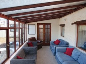 Conservatory seating area in Bryn Eryr Accommodation