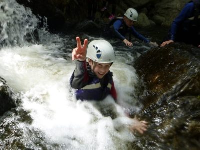 Outdoor activity course in gorge with school pupil