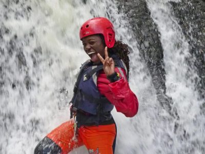 Outdoor gorge scrambling course under waterfall in North Wales