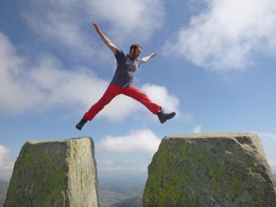 Celebrating top of mountain while walking outdoors
